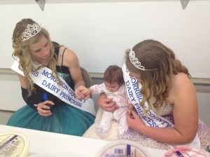 Vivian getting pointers from the Dairy Princesses